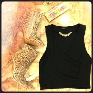 Black V-neck shirt, diamond silver & gold necklace